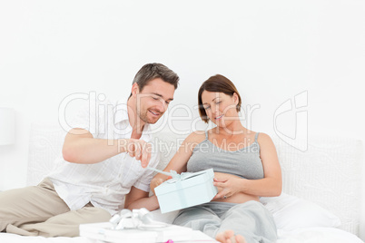 Woman offering a gift to her wife