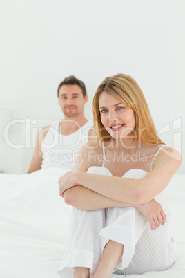 Superb woman looking at the camera with her husband