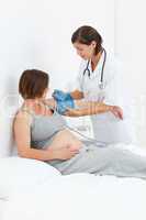 Pregnant woman with a nurse