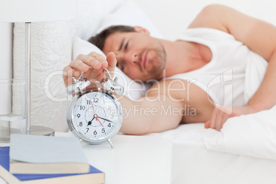 A unhappy man in his bed before waking up