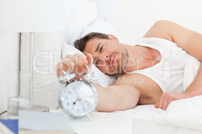 A unhappy man in his bed before waking up