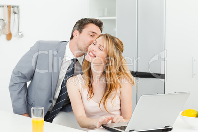 Businessman kissing her girlfriend