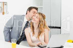 Businessman kissing her girlfriend