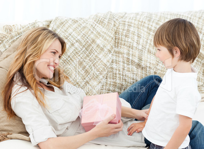 Mother offering present to her son