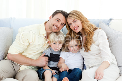 Cute family in their sofa