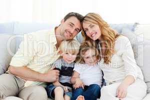 Cute family in their sofa