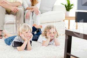 Adorable family watching tv