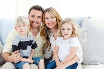 Cute family in their sofa