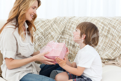 Mother offering present to her son