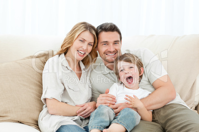 Happy family on their sofa