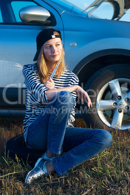 Young Blond Woman With Her Broken Car