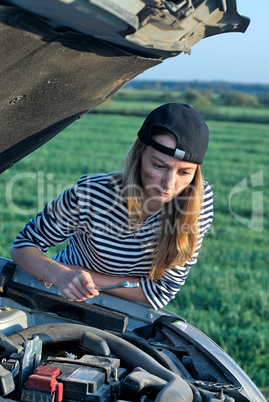 Young Blond Woman With Her Broken Car