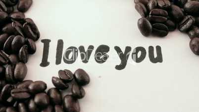 I love you.  written on white under coffee