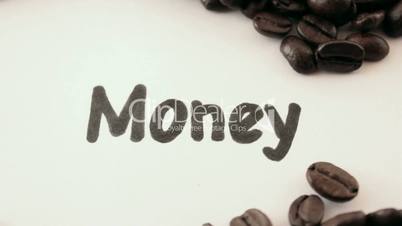 Money.  written on white under coffee