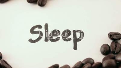 sleep.  written on white under coffee