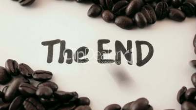 the end.  written on white under coffee