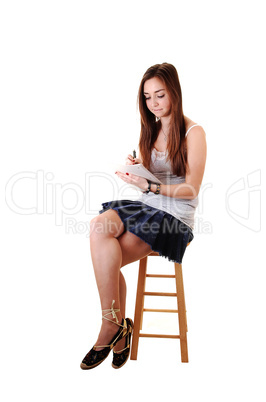 Young girl sitting.