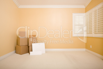 Moving Boxes and Blank Signs on Floor in Empty Room