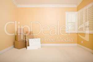 Moving Boxes and Blank Signs on Floor in Empty Room