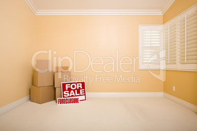 Boxes, Sale and Foreclosure Real Estate Signs in Empty Room