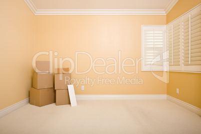 Moving Boxes and Blank Sign in Empty Room