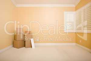 Moving Boxes and Blank Sign in Empty Room
