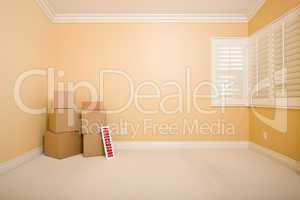 Moving Boxes and Foreclosure Real Estate Sign on Floor in Empty