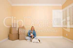 Pretty Woman and Dogs with Moving Boxes in Room on Floor