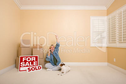 Sold Real Estate Signs, Boxes and Happy Woman on Phone