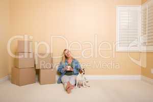 Relaxing Woman and Dog Next to Boxes on Floor