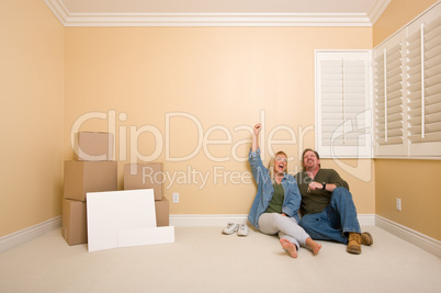 Couple on Floor Near Boxes and Blank Signs