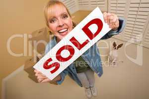 Woman and Doggy with Sold Sign Near Moving Boxes