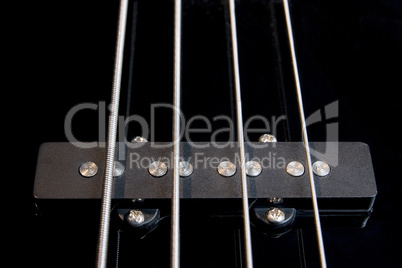 black bass guitar pickup with strained strings