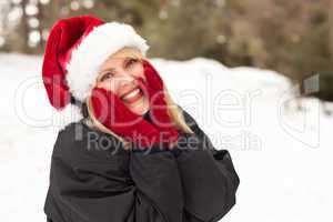 Attractive Santa Hat Wearing Blond Woman Having Fun in Snow