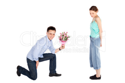 Casual Man Offering Flowers to Woman
