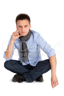 Thoughtful Man Sitting with Legs Crossed