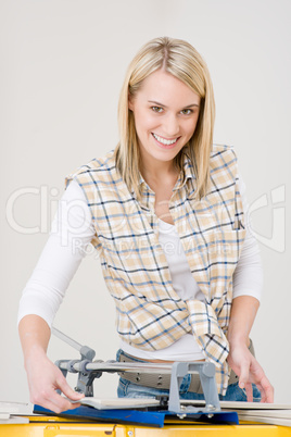 Home improvement - handywoman cutting tile