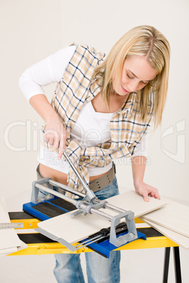 Home improvement - handywoman cutting tile