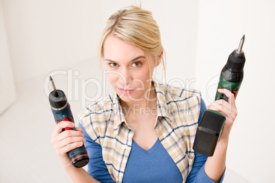 Home improvement - woman with battery screwdriver