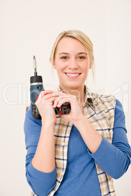 Home improvement - woman with battery screwdriver