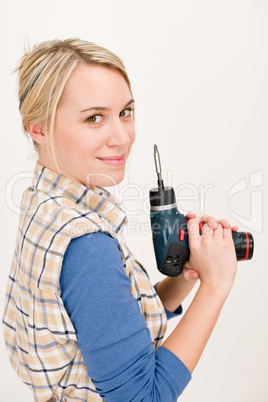 Home improvement - woman with battery screwdriver