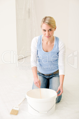 Home improvement - handywoman painting wall