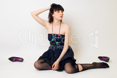 Young woman in torn stockings
