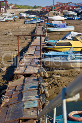 boat marina and a boat moored near the shore