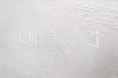 White wall with a powdery substance