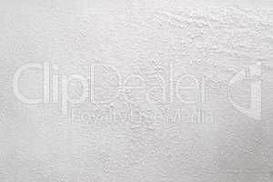 White wall with a powdery substance