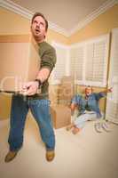 Stressed Man Moving Boxes for Demanding Wife