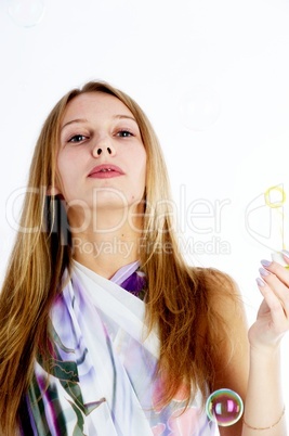 Attractive girl with soap bubbles