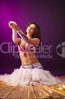 Beauty woman in ballet costume with rose candle