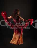 Woman in dark red arabian costume with boa